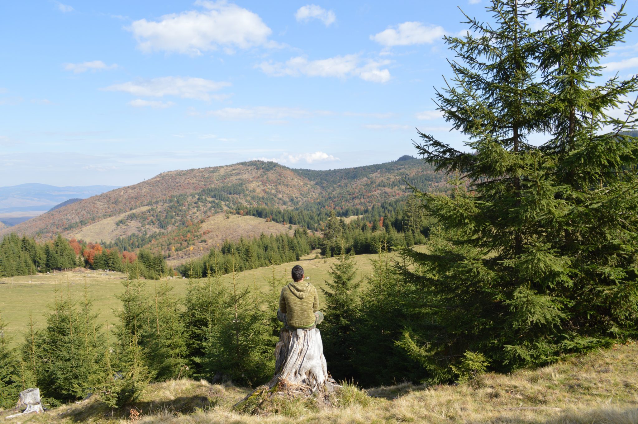 Man meditating looking into valley
